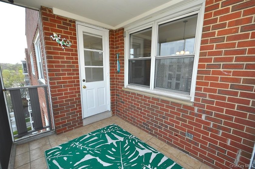 Perched on the top-floor corner, this sun-drenched 2-bedroom - photo 13