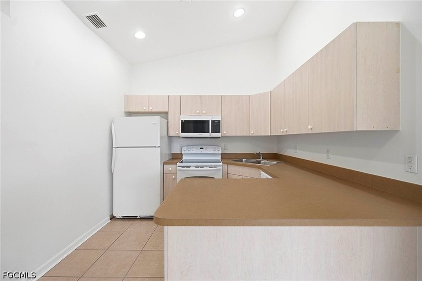 This well-maintained duplex presents a rare opportunity for - photo 12