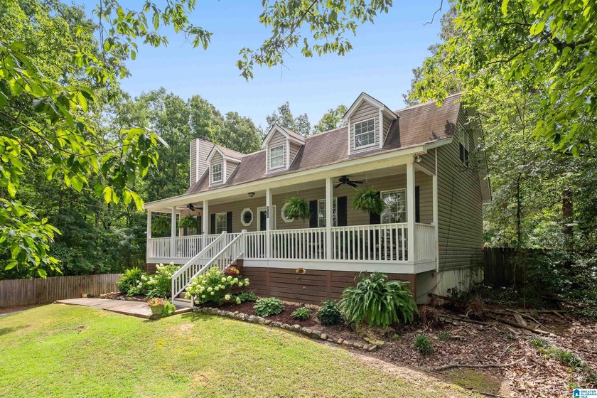 Discover tranquility in this charming lake home nestled in the - photo 3