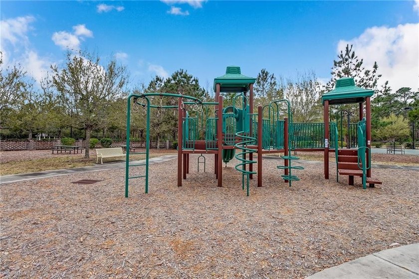 uild your dream home on this beautiful wooded lot in the gated - photo 6