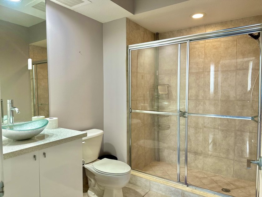 This 12th-floor unit in The Slade offers breathtaking views of - photo 13