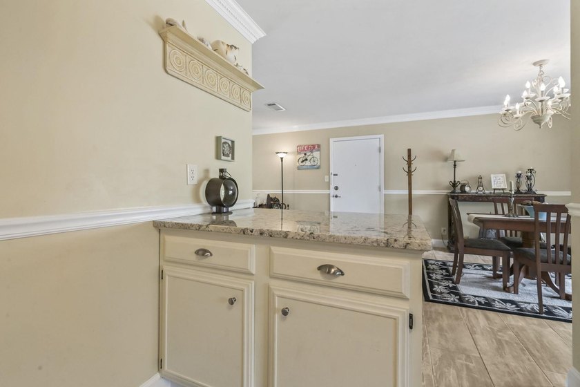 Experience easy coastal living in this beautifully updated - photo 14