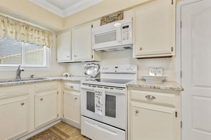 Experience easy coastal living in this beautifully updated - photo 16