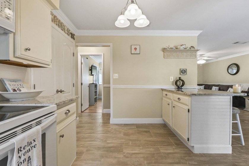 Experience easy coastal living in this beautifully updated - photo 18