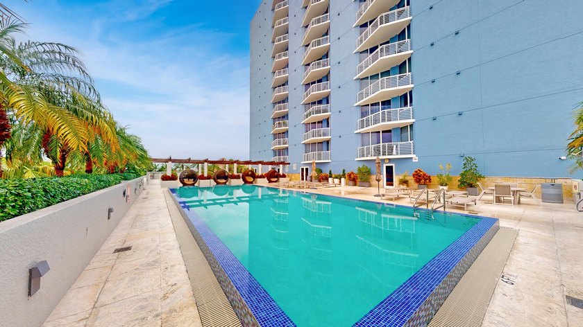 This 12th-floor unit in The Slade offers breathtaking views of - photo 22