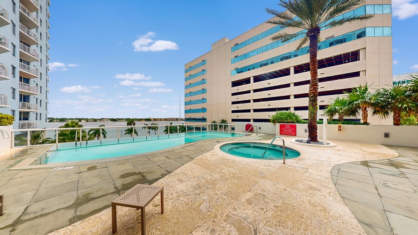 This 12th-floor unit in The Slade offers breathtaking views of - photo 23