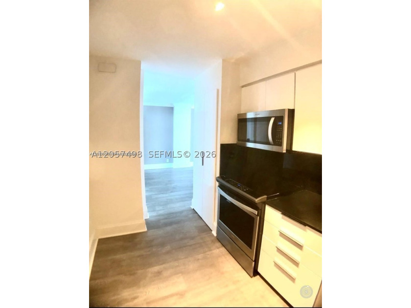 COMPLETELY REMODELED PENTHOUSE WITH STUNNING OCEAN AND CITY - photo 3