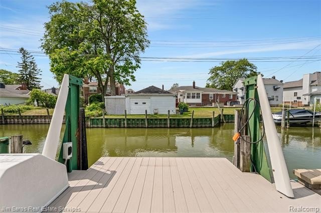 Welcome home to this updated, canal-front, brick ranch, with - photo 7