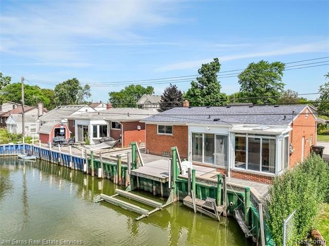 Welcome home to this updated, canal-front, brick ranch, with - photo 8