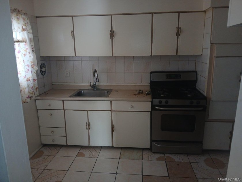 This is a charming two-family home that offers great potential - photo 5
