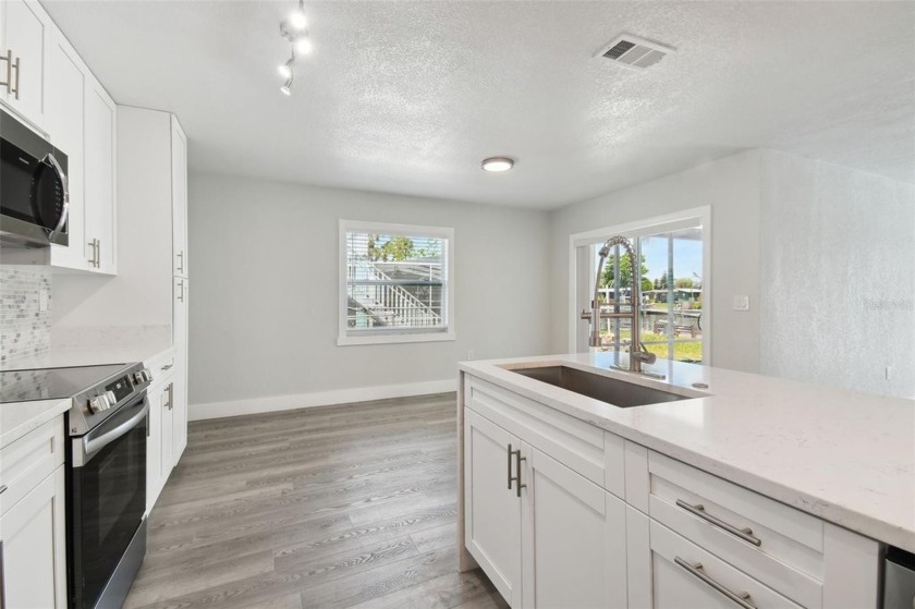 Welcome to your waterfront life; this spectacular 3 bedroom, 2 - photo 15
