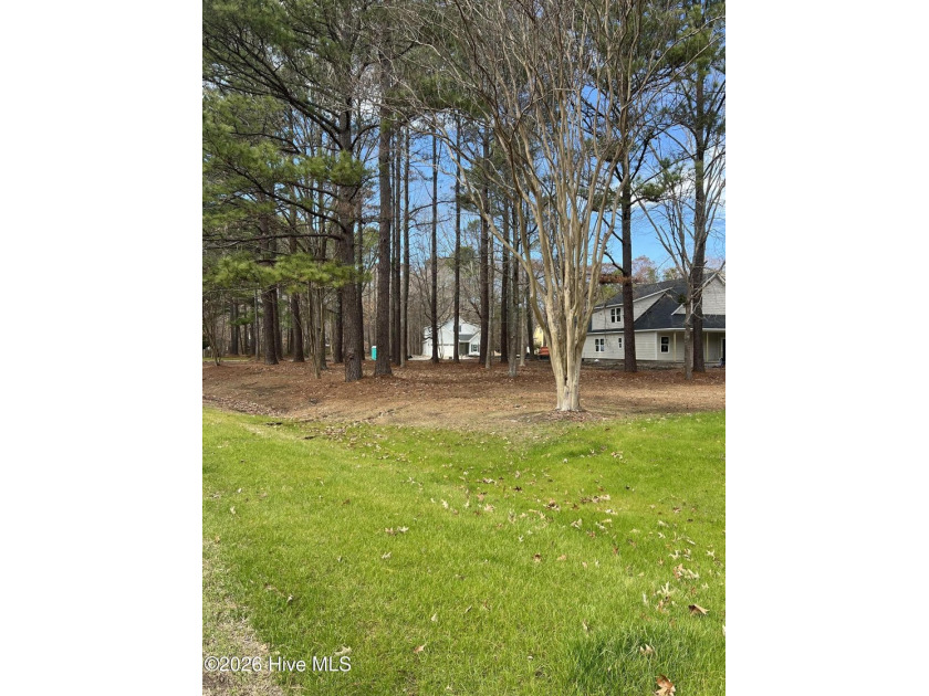 Corner wooded lot with mature trees offering privacy in a gated - photo 2