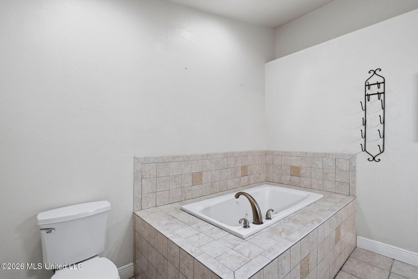 Welcome home to this spacious 4BR/2BA residence offering the - photo 14