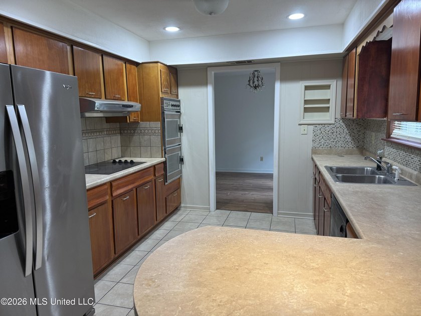 This well-maintained 4-bedroom, 2-bath brick home is situated on - photo 17
