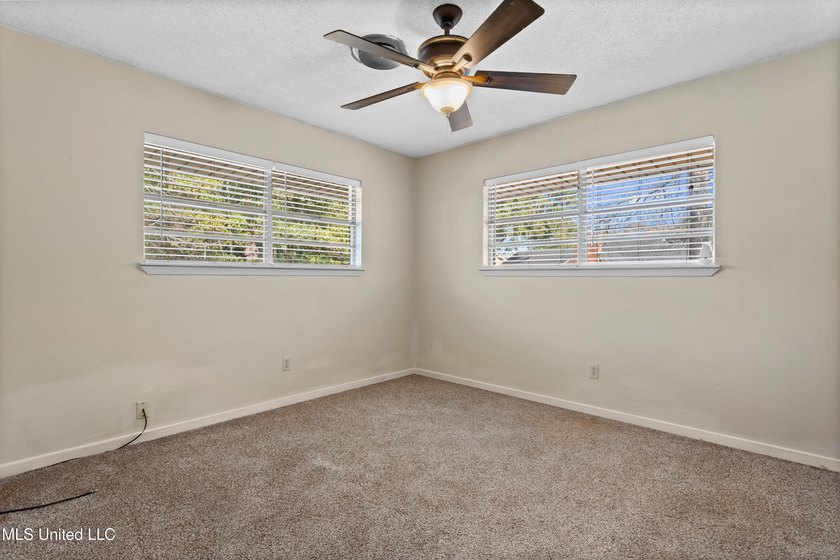 This well-maintained 4-bedroom, 2-bath brick home is situated on - photo 21