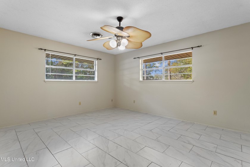 This well-maintained 4-bedroom, 2-bath brick home is situated on - photo 28