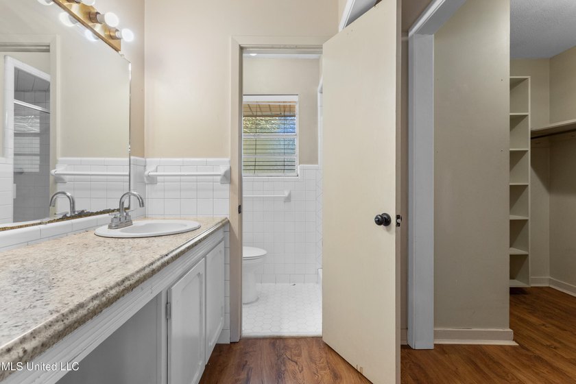 This well-maintained 4-bedroom, 2-bath brick home is situated on - photo 30