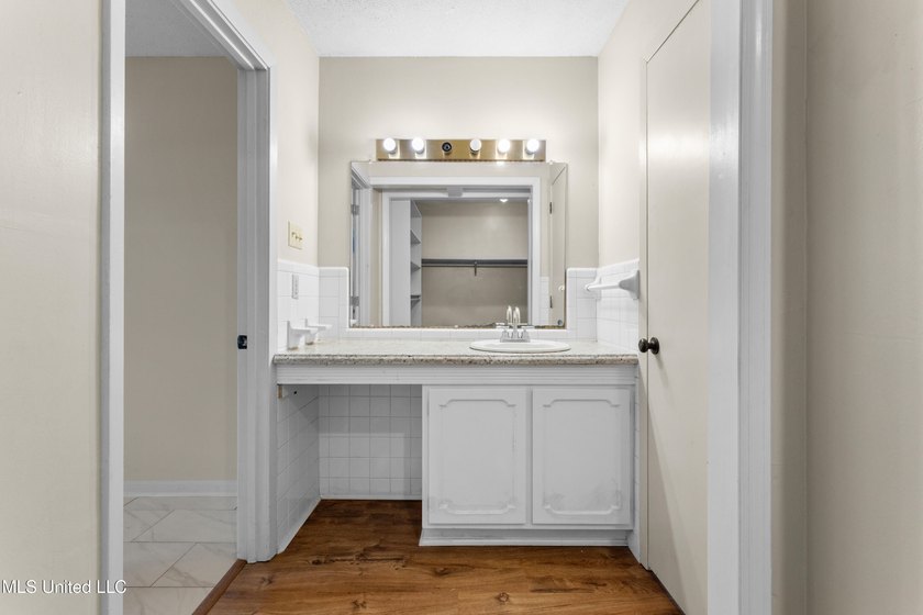 This well-maintained 4-bedroom, 2-bath brick home is situated on - photo 31