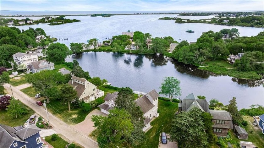 Perched at the water's edge, 19 Teal Drive is a custom-built - photo 13