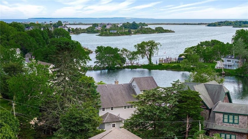 Perched at the water's edge, 19 Teal Drive is a custom-built - photo 14