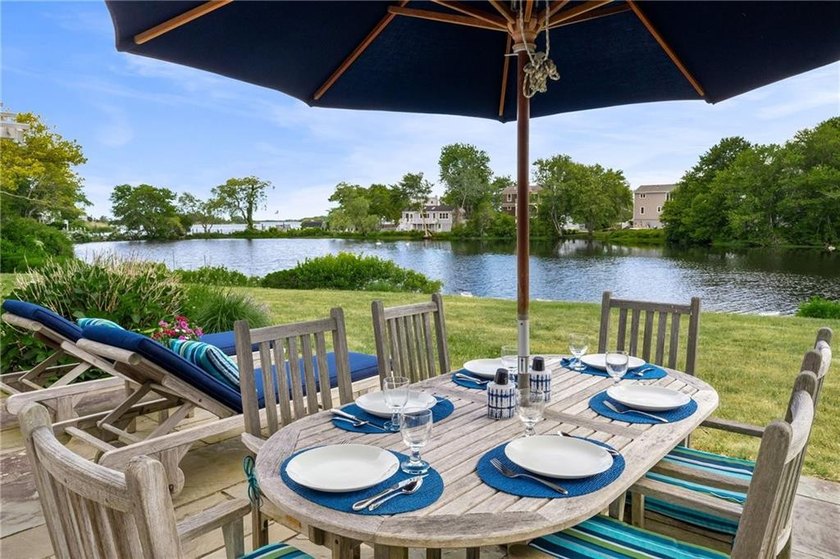Perched at the water's edge, 19 Teal Drive is a custom-built - photo 15