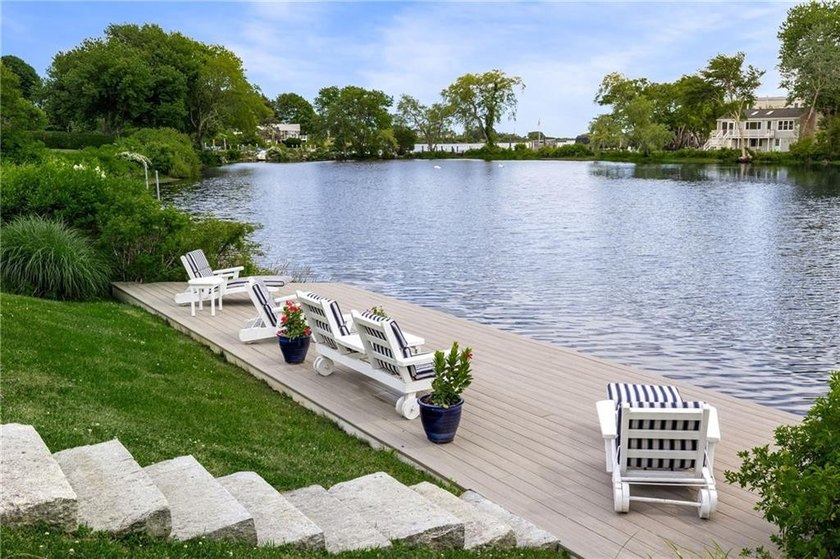 Perched at the water's edge, 19 Teal Drive is a custom-built - photo 16