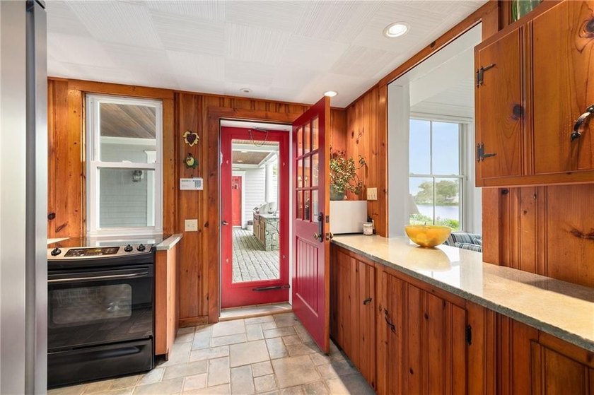 Perched at the water's edge, 19 Teal Drive is a custom-built - photo 22