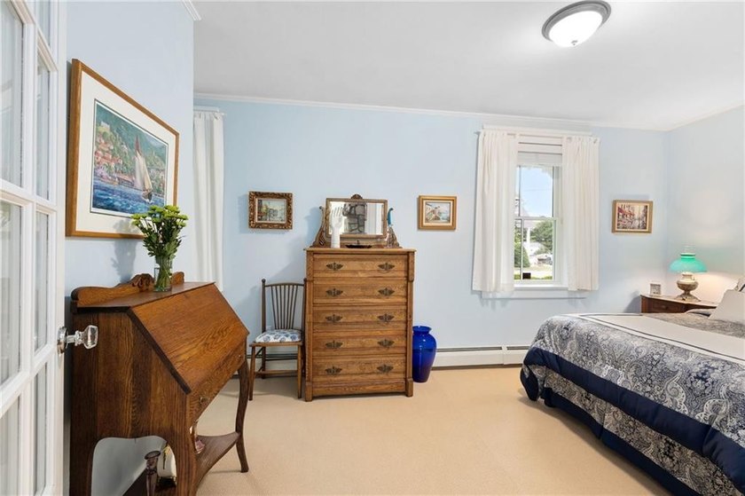 Perched at the water's edge, 19 Teal Drive is a custom-built - photo 27