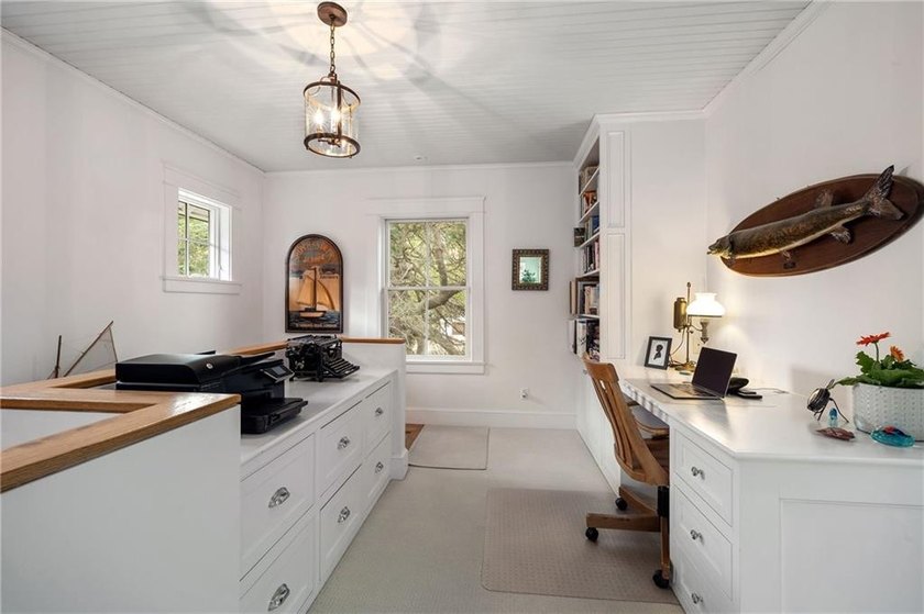 Perched at the water's edge, 19 Teal Drive is a custom-built - photo 29