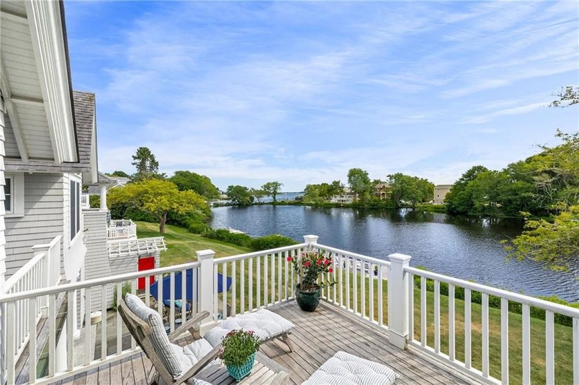 Perched at the water's edge, 19 Teal Drive is a custom-built - photo 35