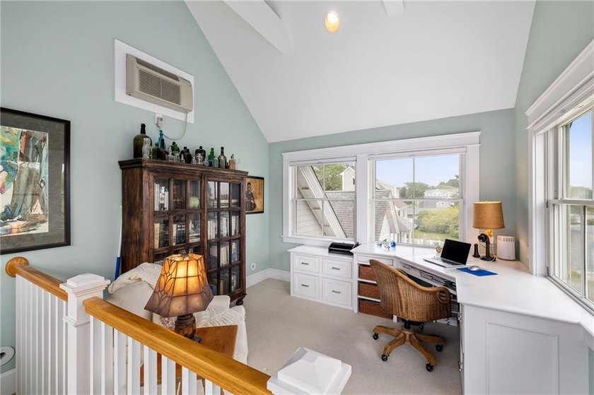 Perched at the water's edge, 19 Teal Drive is a custom-built - photo 38