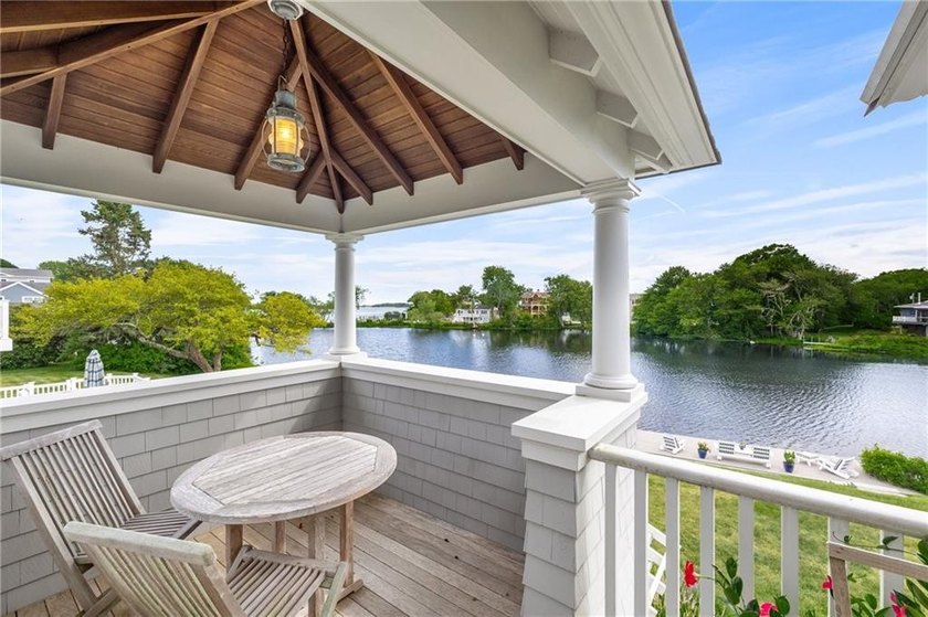 Perched at the water's edge, 19 Teal Drive is a custom-built - photo 44