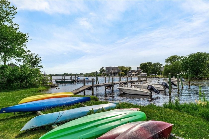 Perched at the water's edge, 19 Teal Drive is a custom-built - photo 50