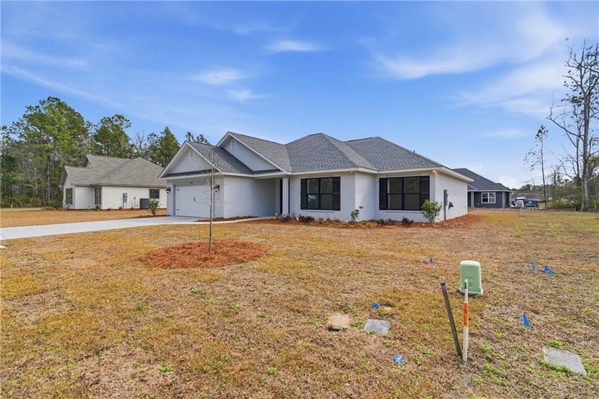This is a beautiful 4 bedroom, 2 bathroom stucco home that has - photo 3