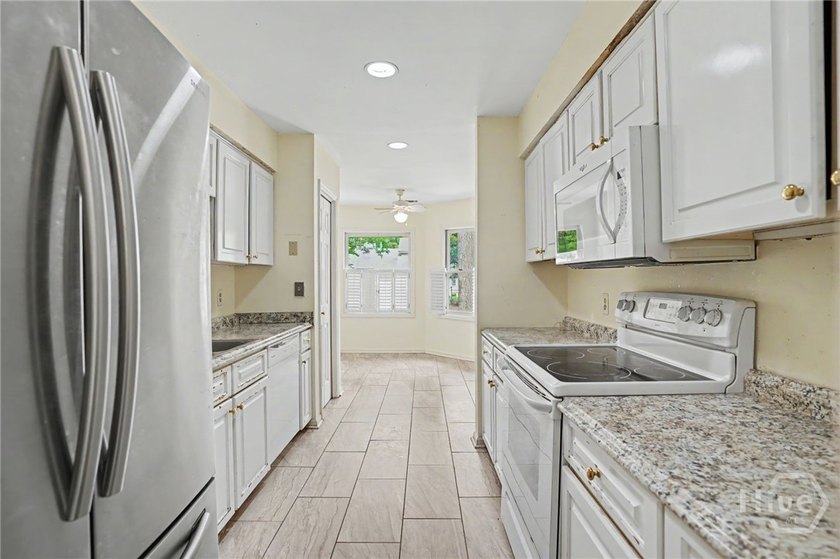 This end-unit townhome offers extra privacy and a practical - photo 7