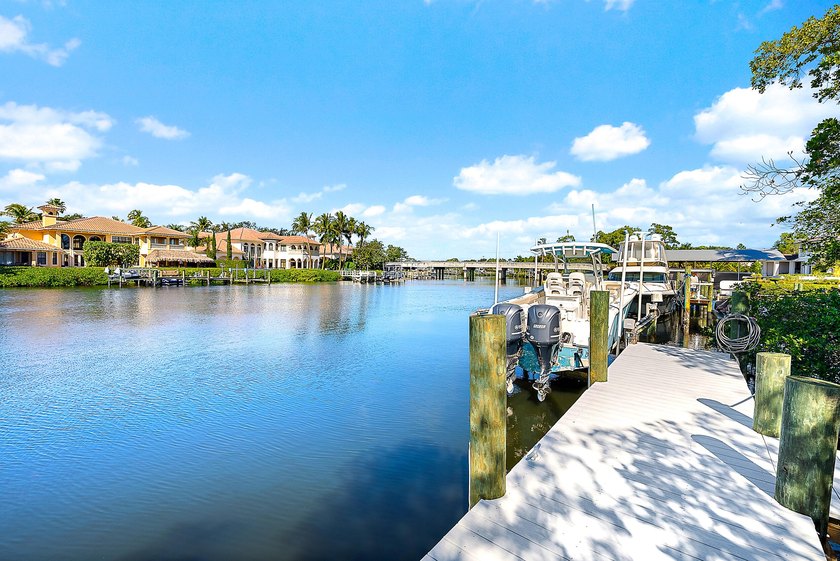 This gorgeous riverfront home boasts 100 feet of water frontage - photo 3