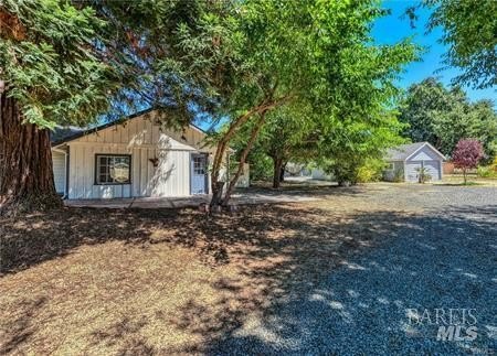 7.29-acre ranch featuring three distinct residential units. This - photo 2