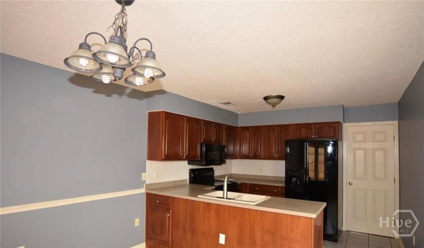Welcome home to this spacious 5-bedroom, 2.5-bath residence in - photo 6