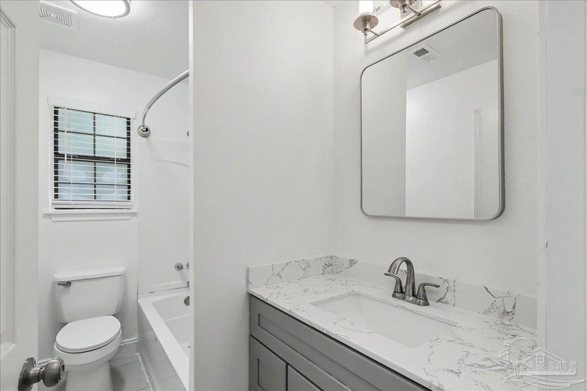 Welcome to this beautifully updated 3-bedroom, 2-bath brick home - photo 13
