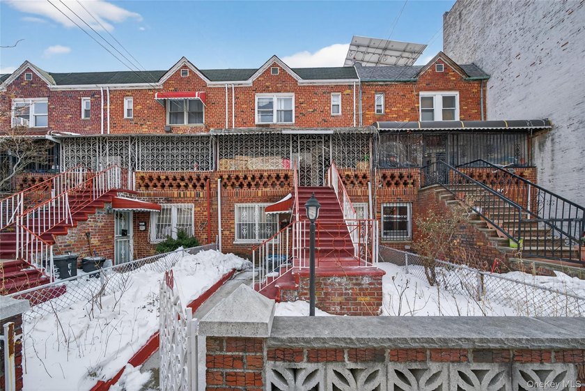 Well-maintained 3-story, 2-family brick home featuring a - photo 2