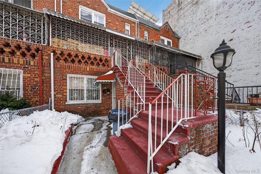 Well-maintained 3-story, 2-family brick home featuring a - photo 3