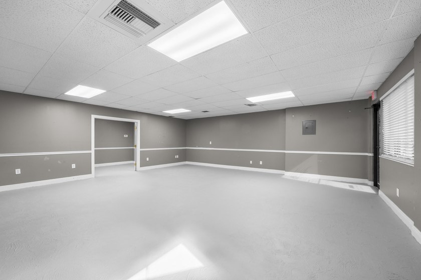 Bright, open showroom with newly applied SunDek finished floors - photo 4