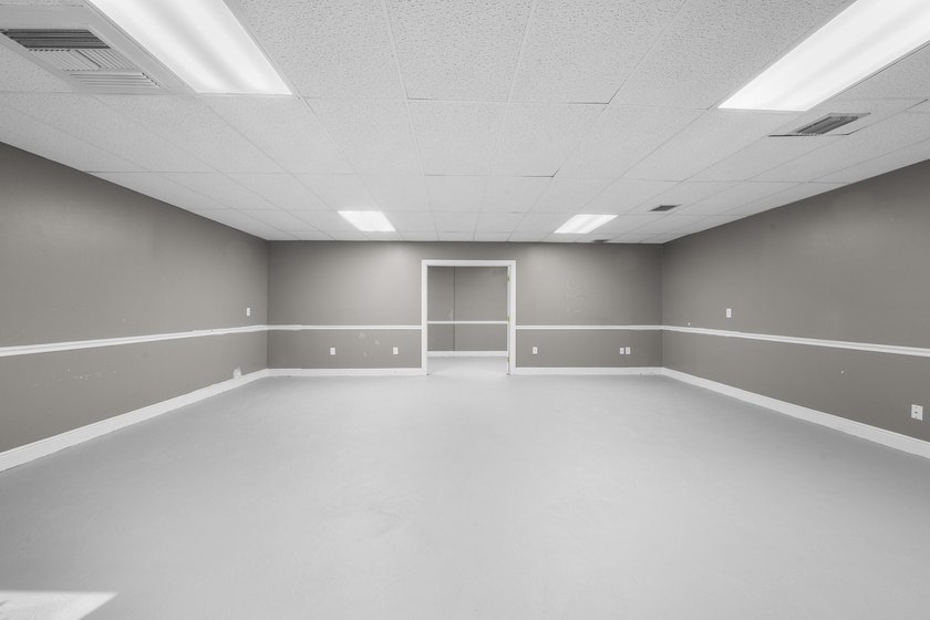 Bright, open showroom with newly applied SunDek finished floors - photo 5