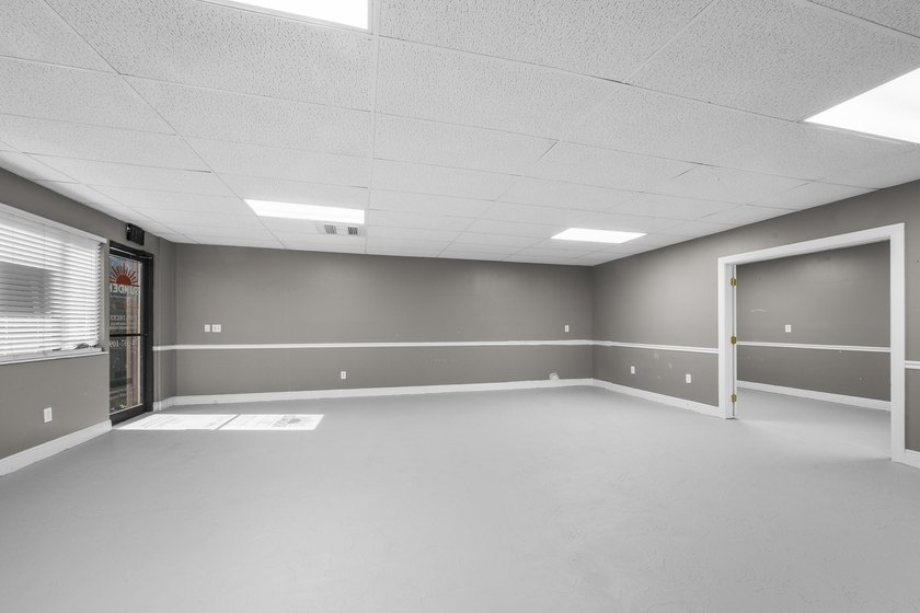 Bright, open showroom with newly applied SunDek finished floors - photo 6
