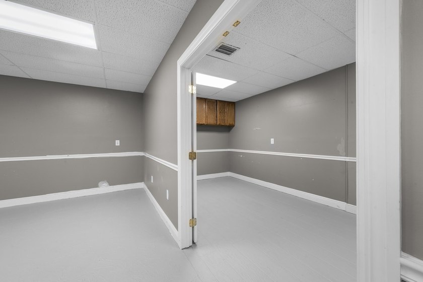 Bright, open showroom with newly applied SunDek finished floors - photo 7