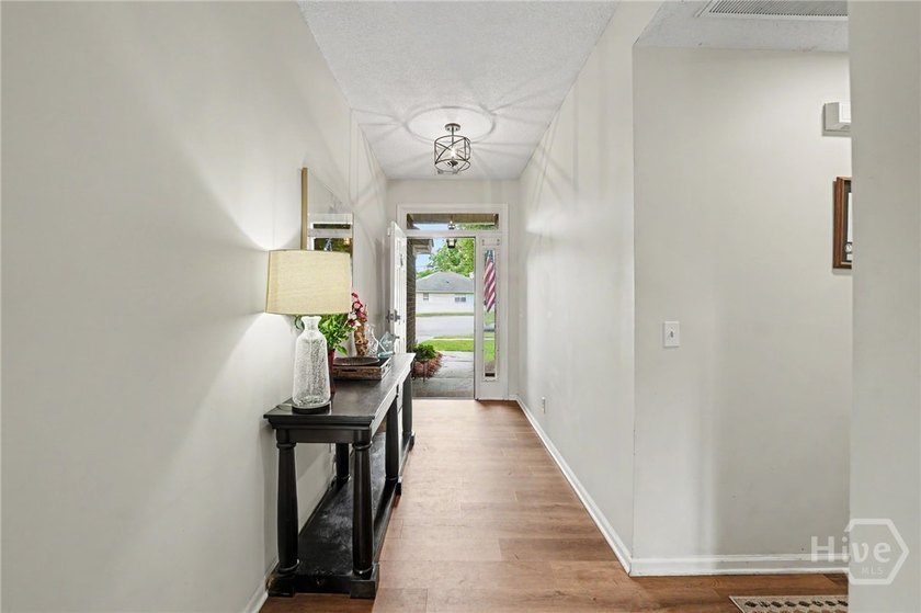 This thoughtfully updated and maintained 4-bedroom ranch sits on - photo 5