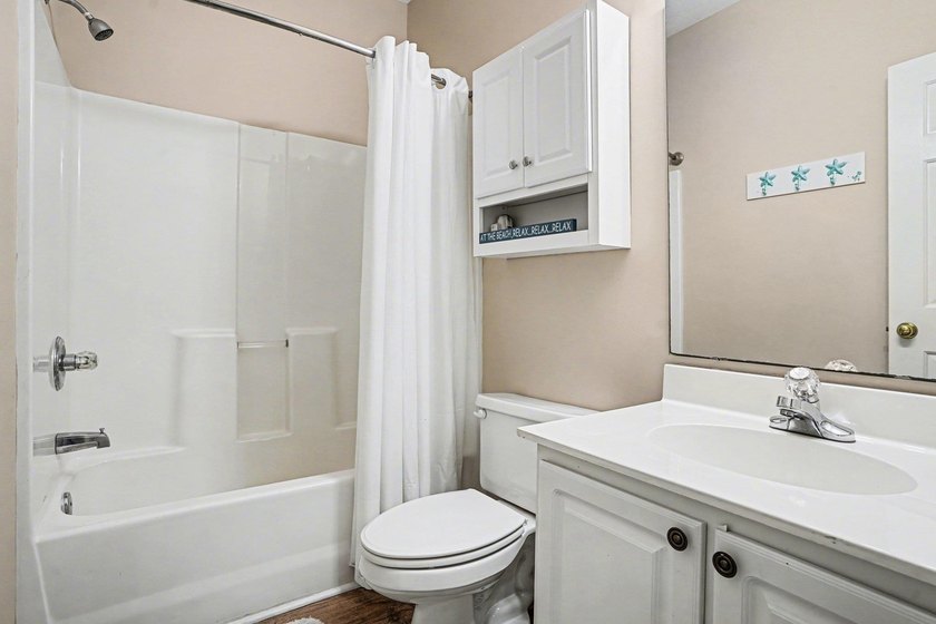 Enjoy comfortable coastal living in this charming two-bedroom - photo 19