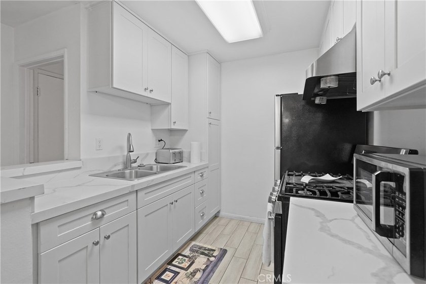 Welcome to a masterfully reimagined, move-in-ready home where - photo 16
