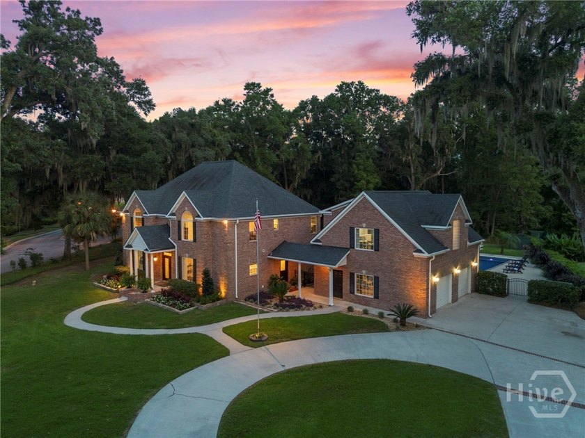 Nestled beneath majestic live oaks on a picturesque 1.9-acre - photo 3