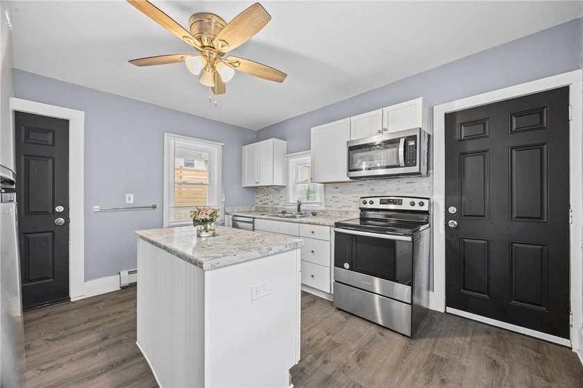 Welcome to 171 Oakland Street! This 4-bedroom, 2-bath home - photo 17